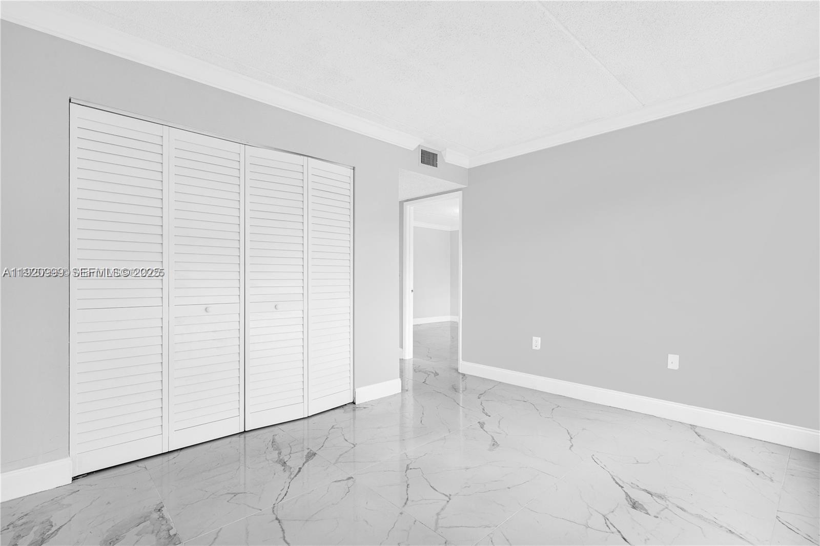 6135 Northwest 186th Street, Unit 202 Hialeah, FL 33015 - Photo 13 of 21 an empty room with a empty space