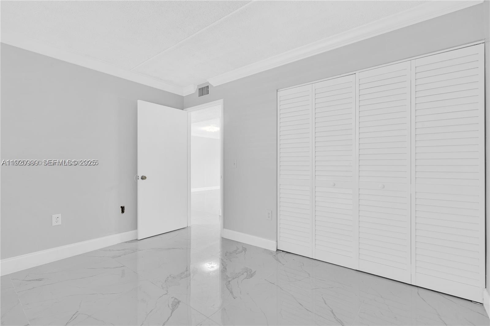 6135 Northwest 186th Street, Unit 202 Hialeah, FL 33015 - Photo 15 of 21 a view of an empty room