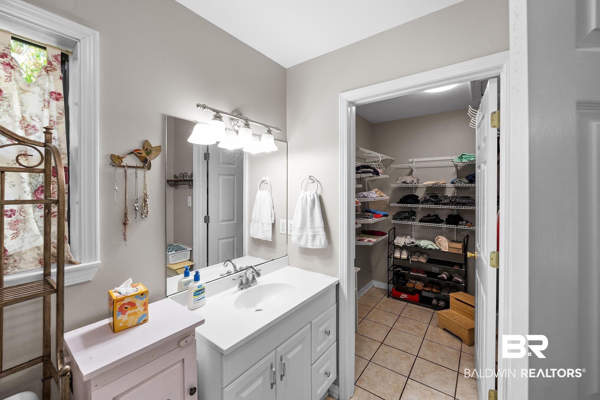 4026 Kingsrow Row Mobile, AL 36619 - Photo 26 of 51 Bathroom featuring vanity, light tile patterned floors, and a spacious closet