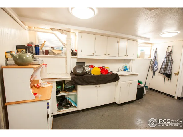 a utility room with sink dryer and washer