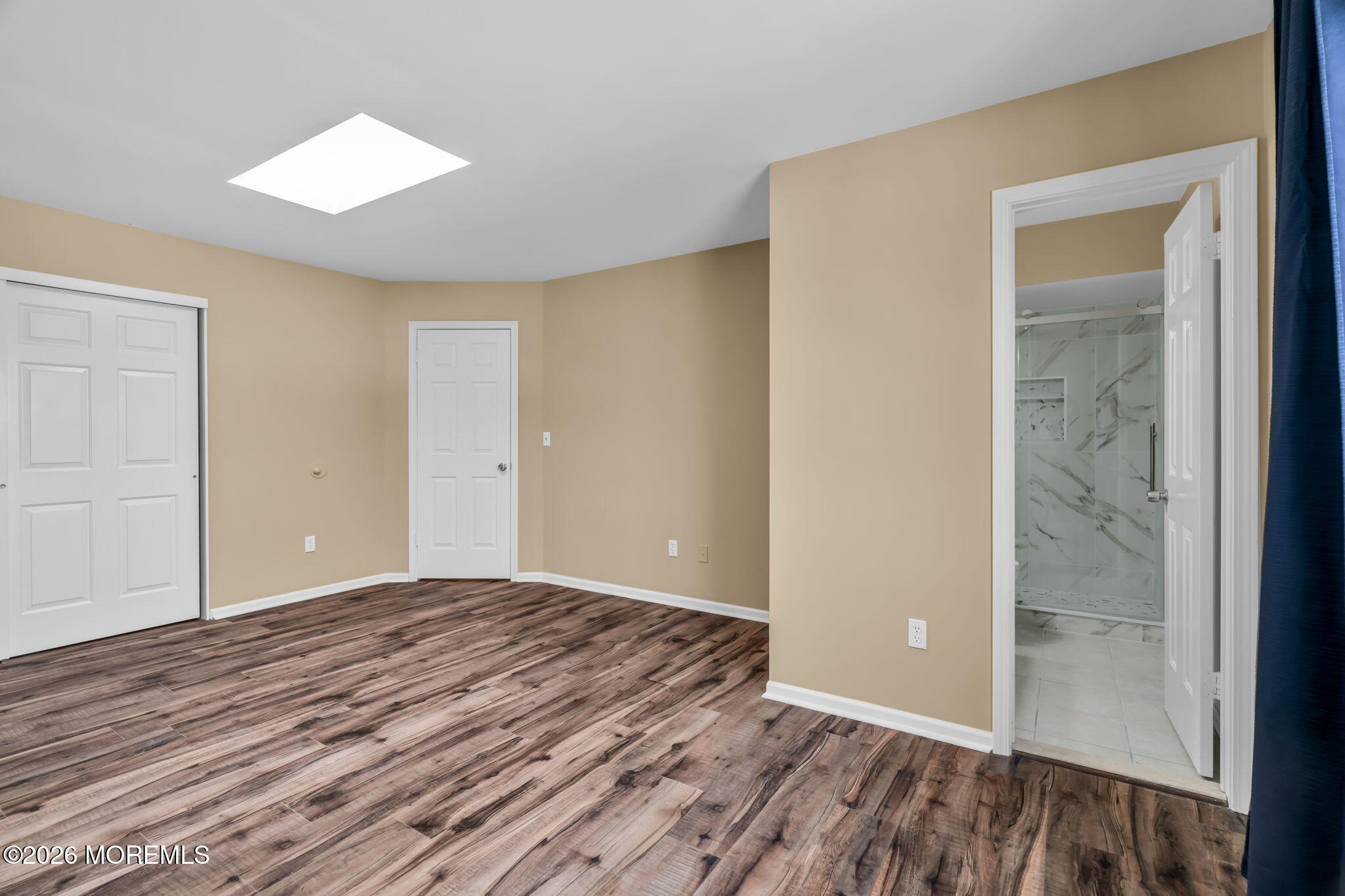 120 South Concourse, Unit 310 Neptune Township, NJ 07753 - Photo 14 of 44 a view of an empty room and wooden floor