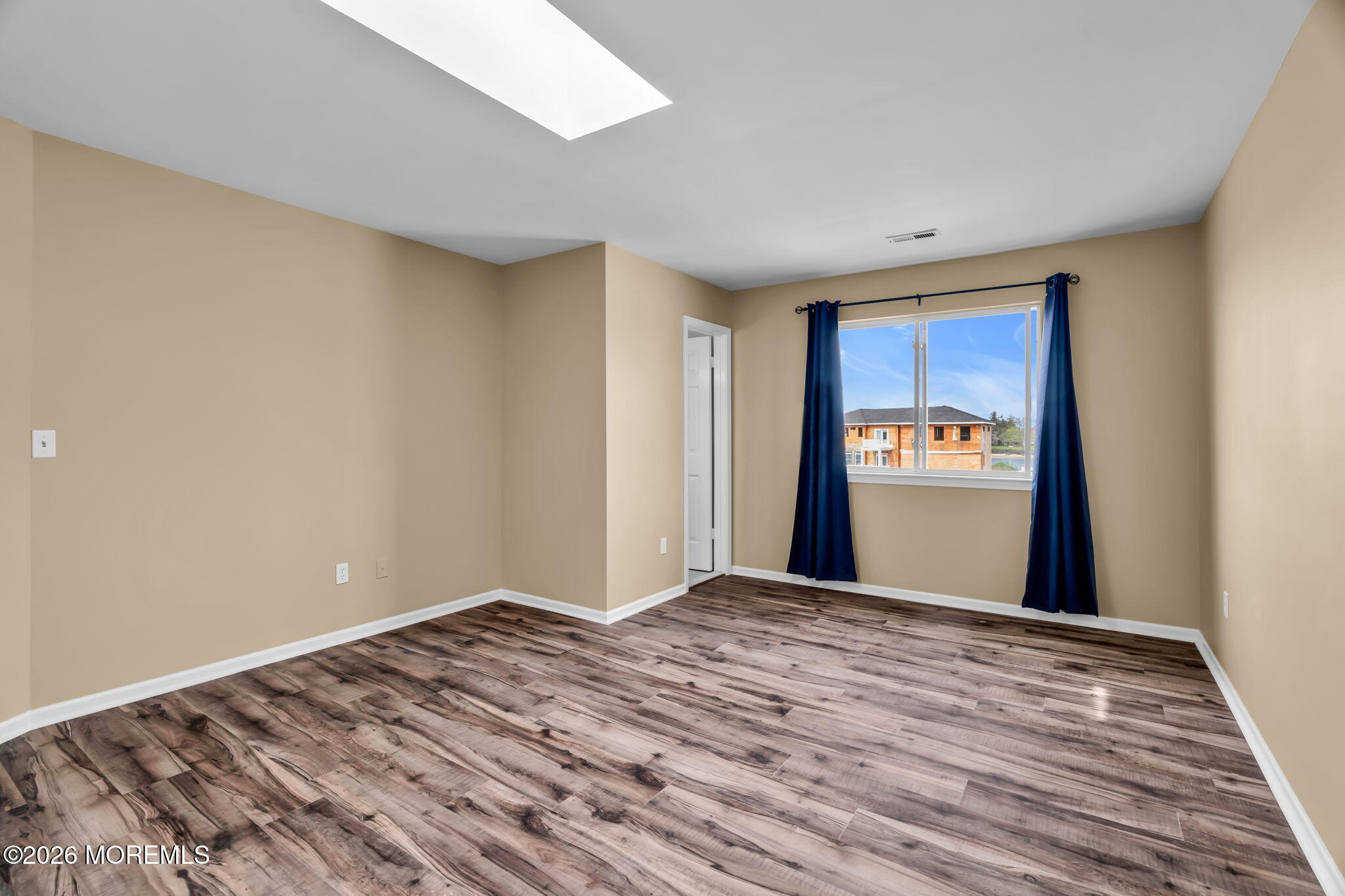 120 South Concourse, Unit 310 Neptune Township, NJ 07753 - Photo 15 of 44 a view of a room with wooden floor