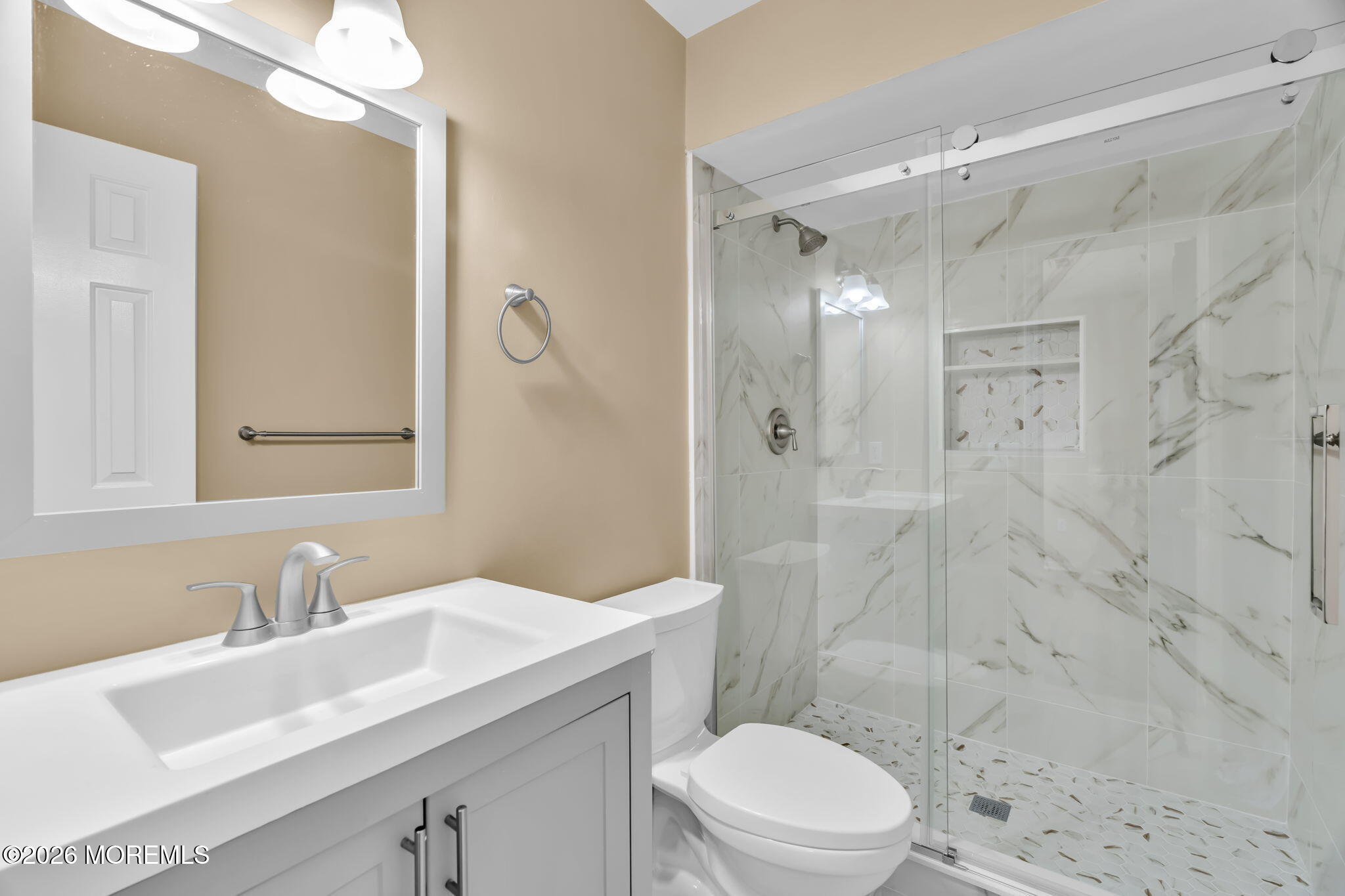 120 South Concourse, Unit 310 Neptune Township, NJ 07753 - Photo 16 of 44 a bathroom with a sink toilet a mirror and shower