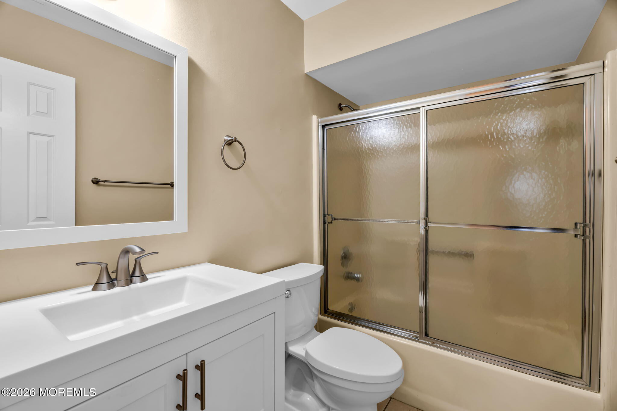 120 South Concourse, Unit 310 Neptune Township, NJ 07753 - Photo 17 of 44 a bathroom with a shower sink vanity mirror and toilet