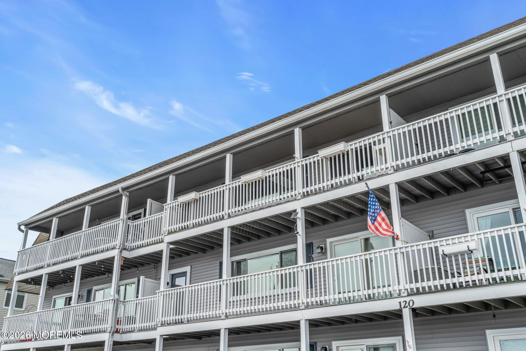 120 South Concourse, Unit 310 Neptune Township, NJ 07753 - Photo 28 of 44 a view of balcony with wooden floor and fence