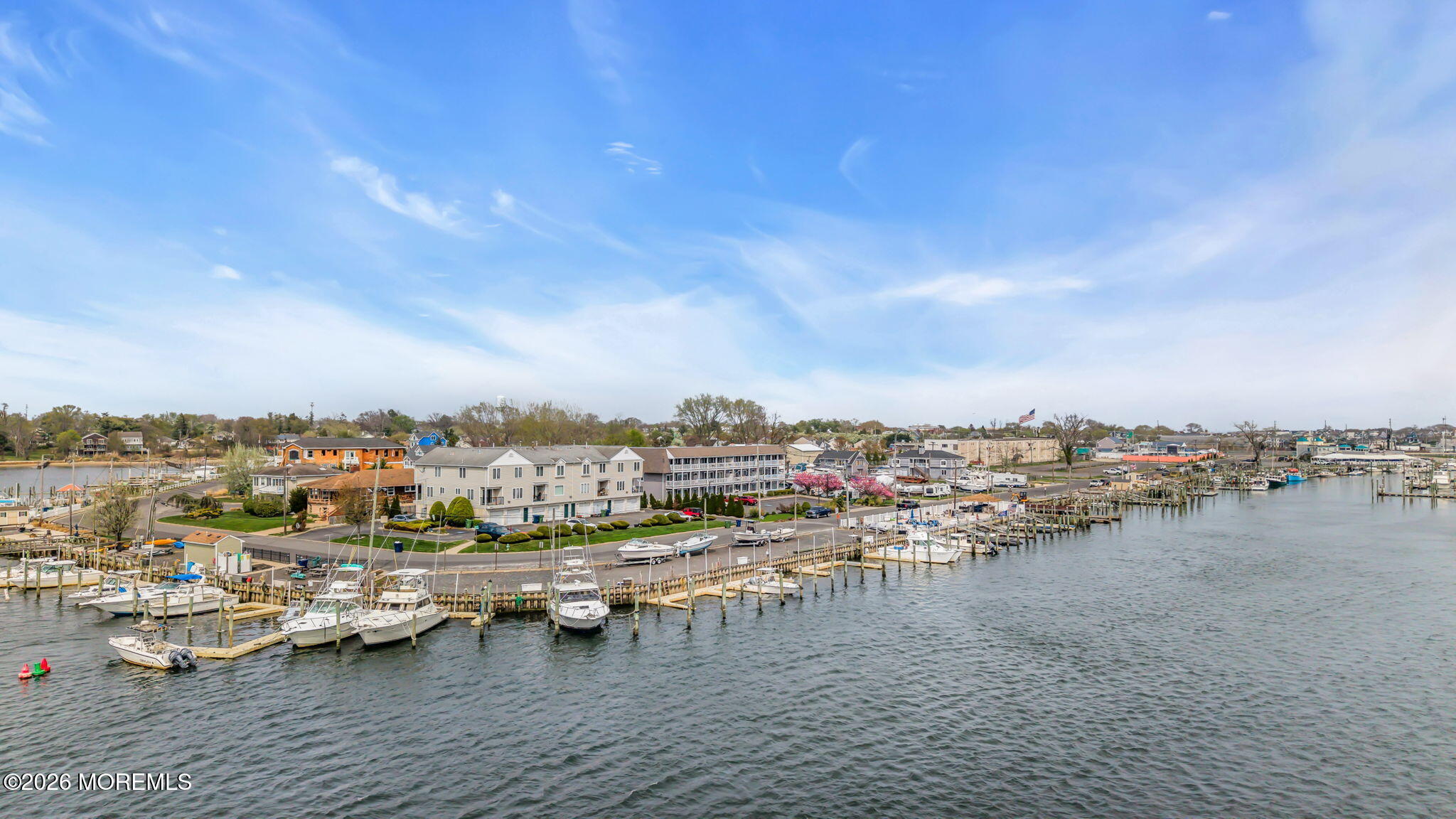 120 South Concourse, Unit 310 Neptune Township, NJ 07753 - Photo 35 of 44 a view of a lake with lots of residential buildings