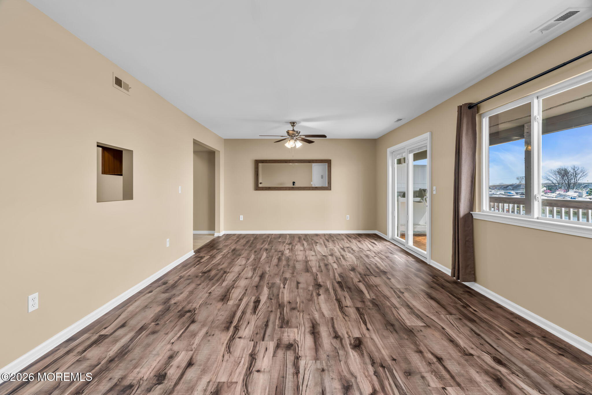 120 South Concourse, Unit 310 Neptune Township, NJ 07753 - Photo 6 of 44 a view of empty room with wooden floor and fan