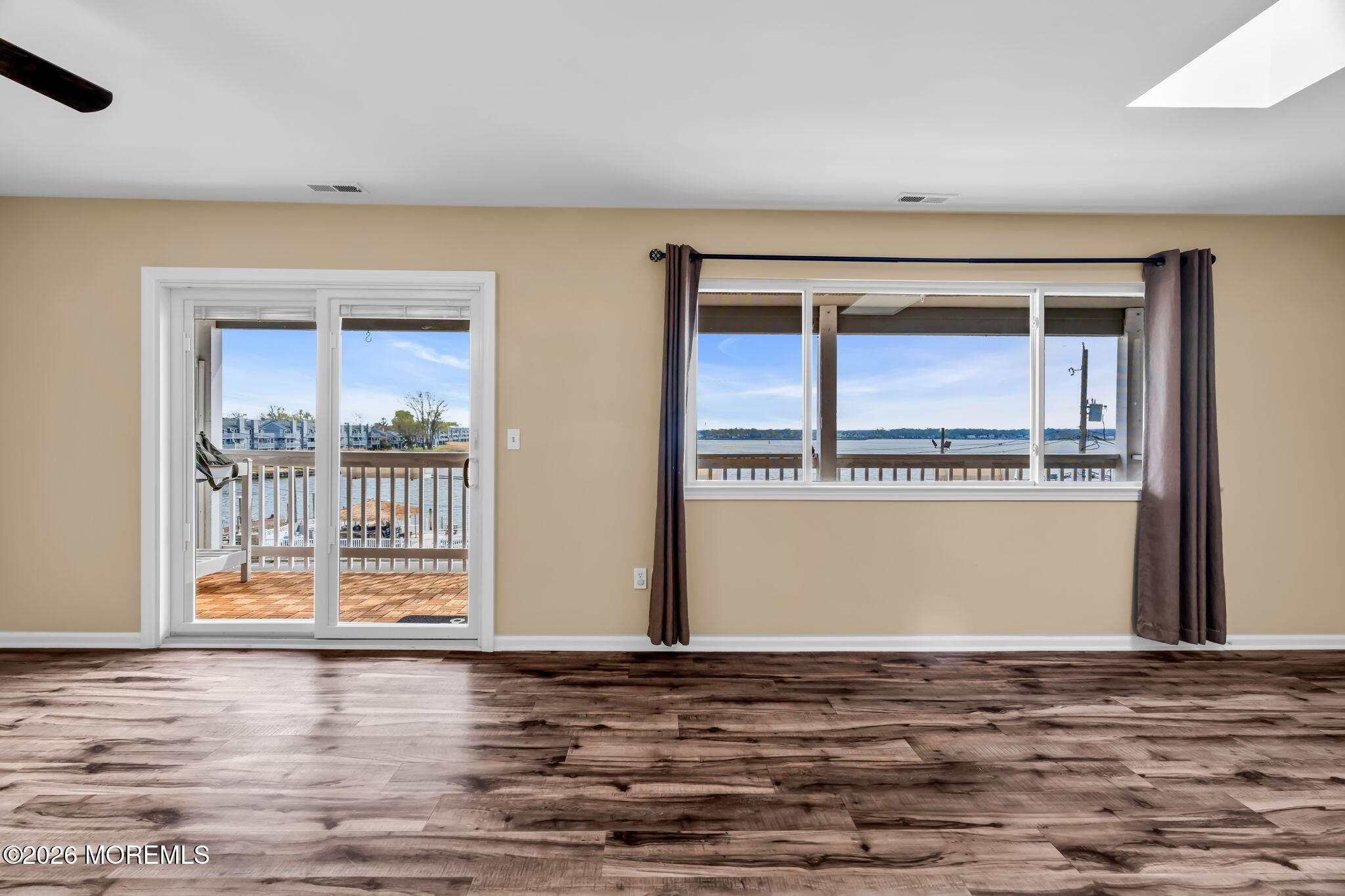 120 South Concourse, Unit 310 Neptune Township, NJ 07753 - Photo 7 of 44 a view of a room with wooden floor and a window