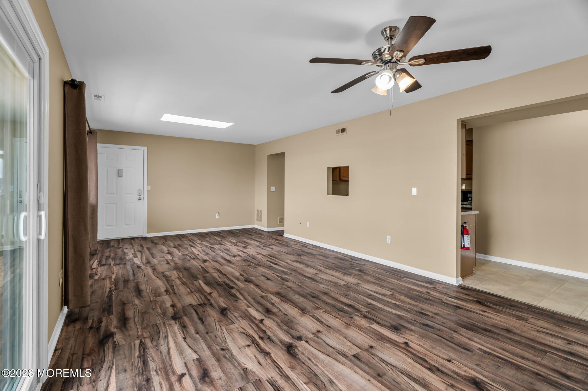 120 South Concourse, Unit 310 Neptune Township, NJ 07753 - Photo 9 of 44 a view of an empty room and wooden floor