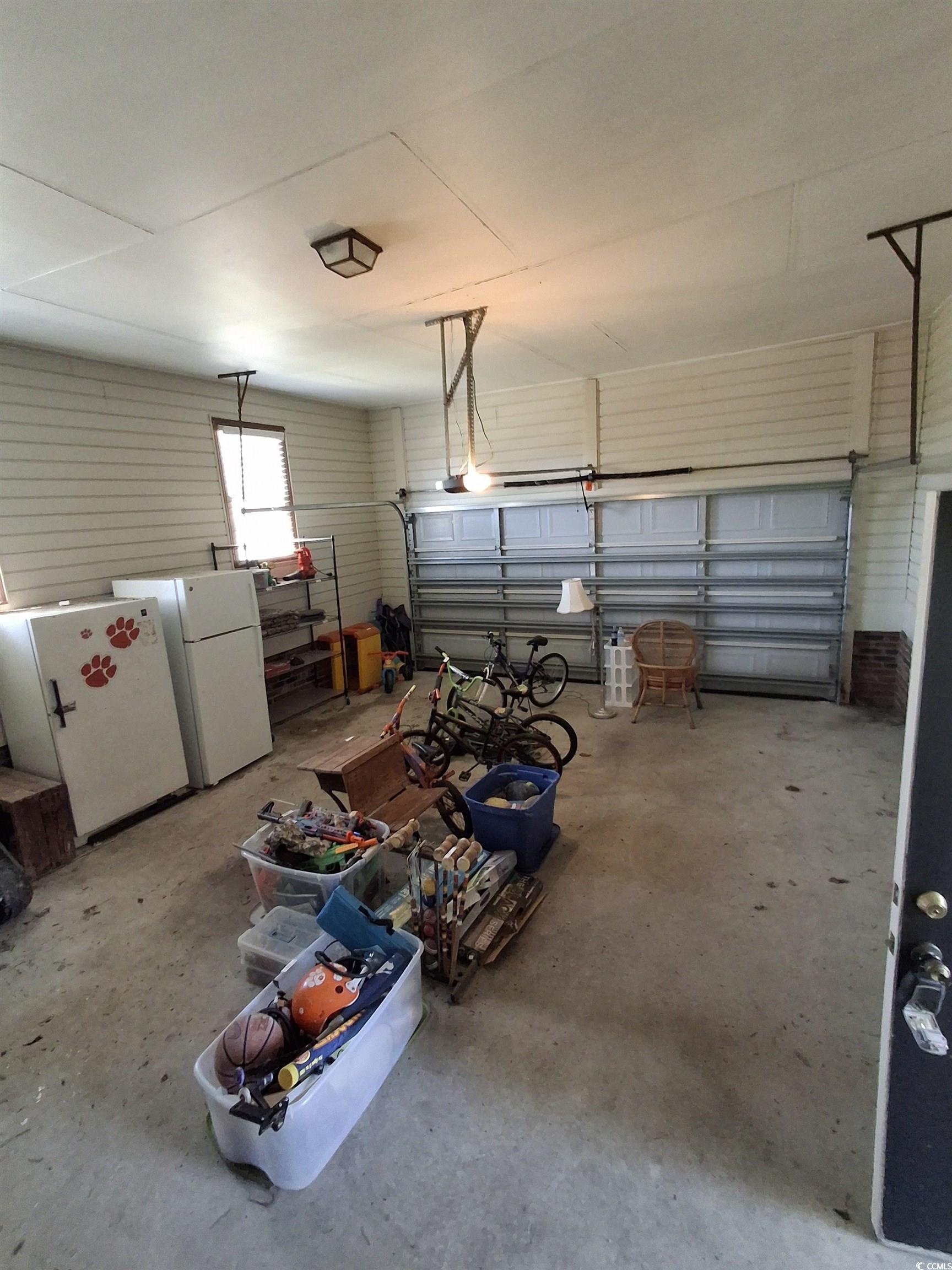 410 Devon Road Marion, SC 29571 - Photo 20 of 38 Garage featuring freestanding refrigerator