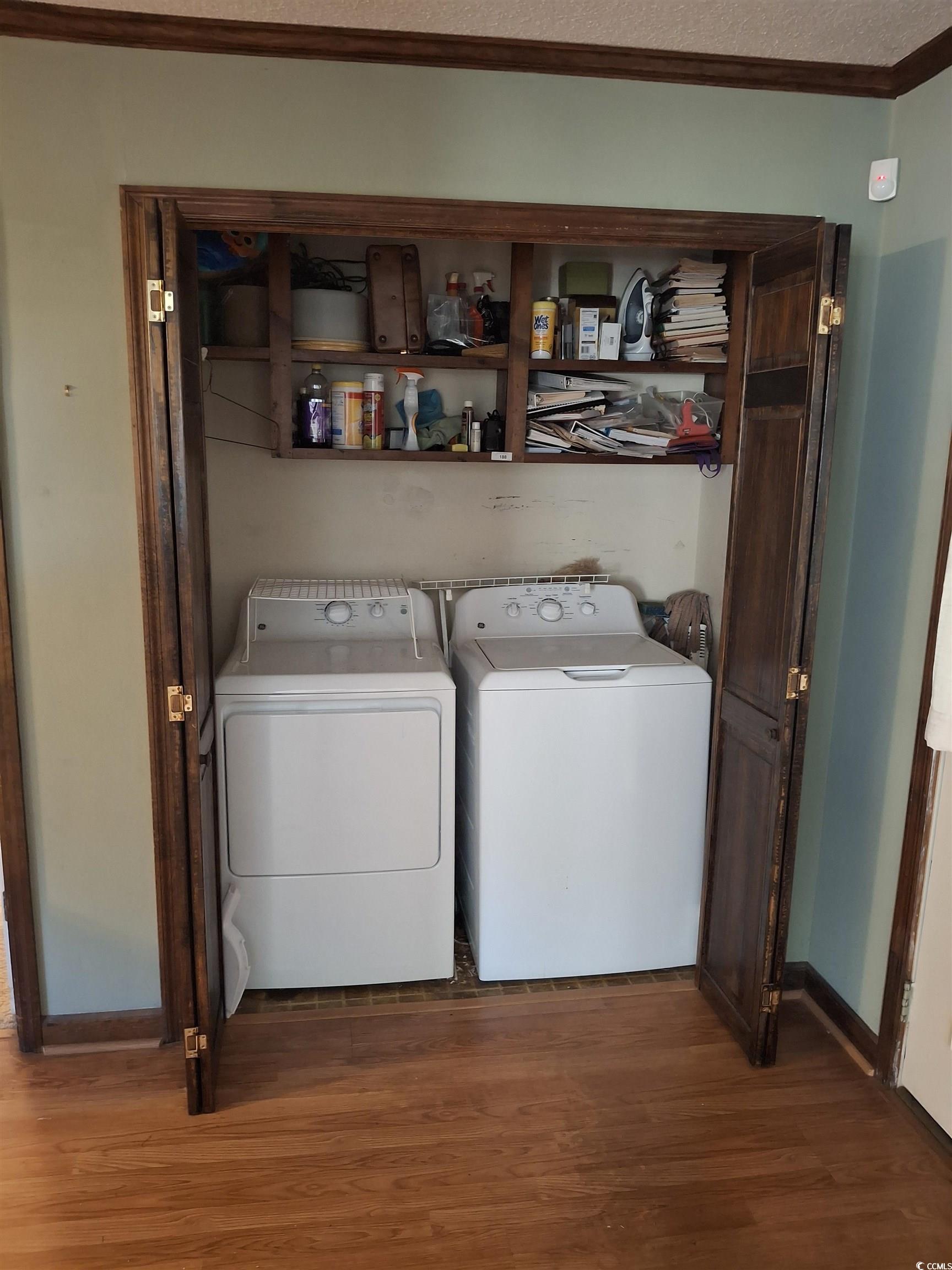 410 Devon Road Marion, SC 29571 - Photo 24 of 38 Laundry room featuring dark wood-type flooring, wa