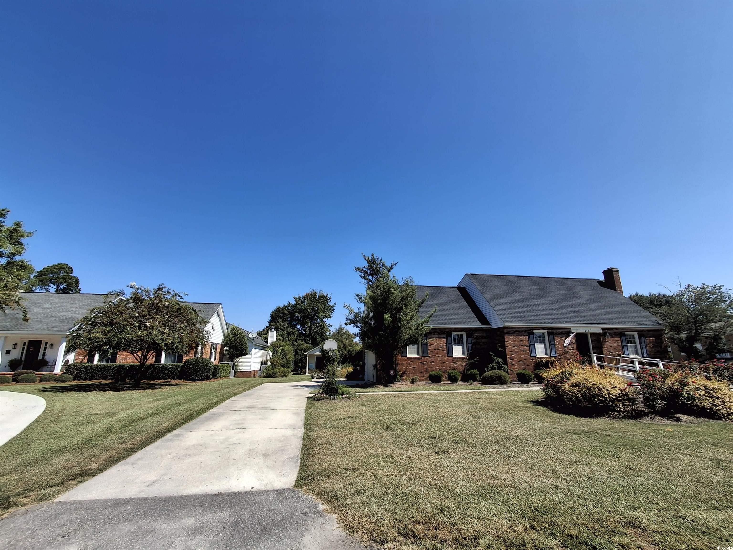 410 Devon Road Marion, SC 29571 - Photo 3 of 38 View of front of property with a front lawn, brick