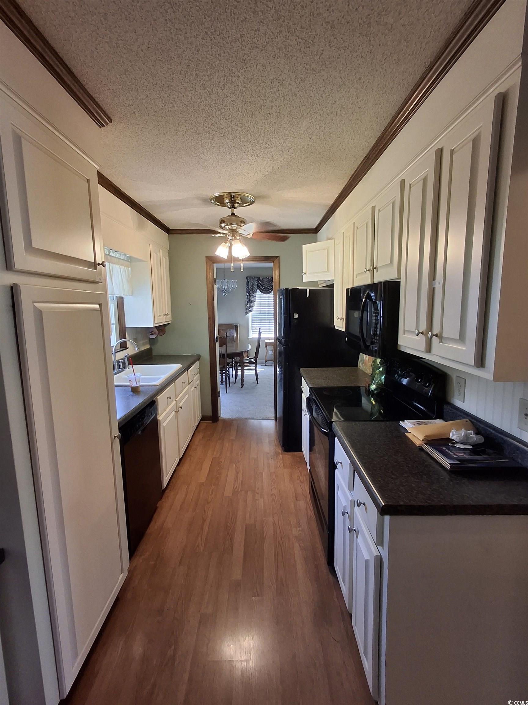 410 Devon Road Marion, SC 29571 - Photo 34 of 38 Kitchen featuring black appliances, ornamental mol