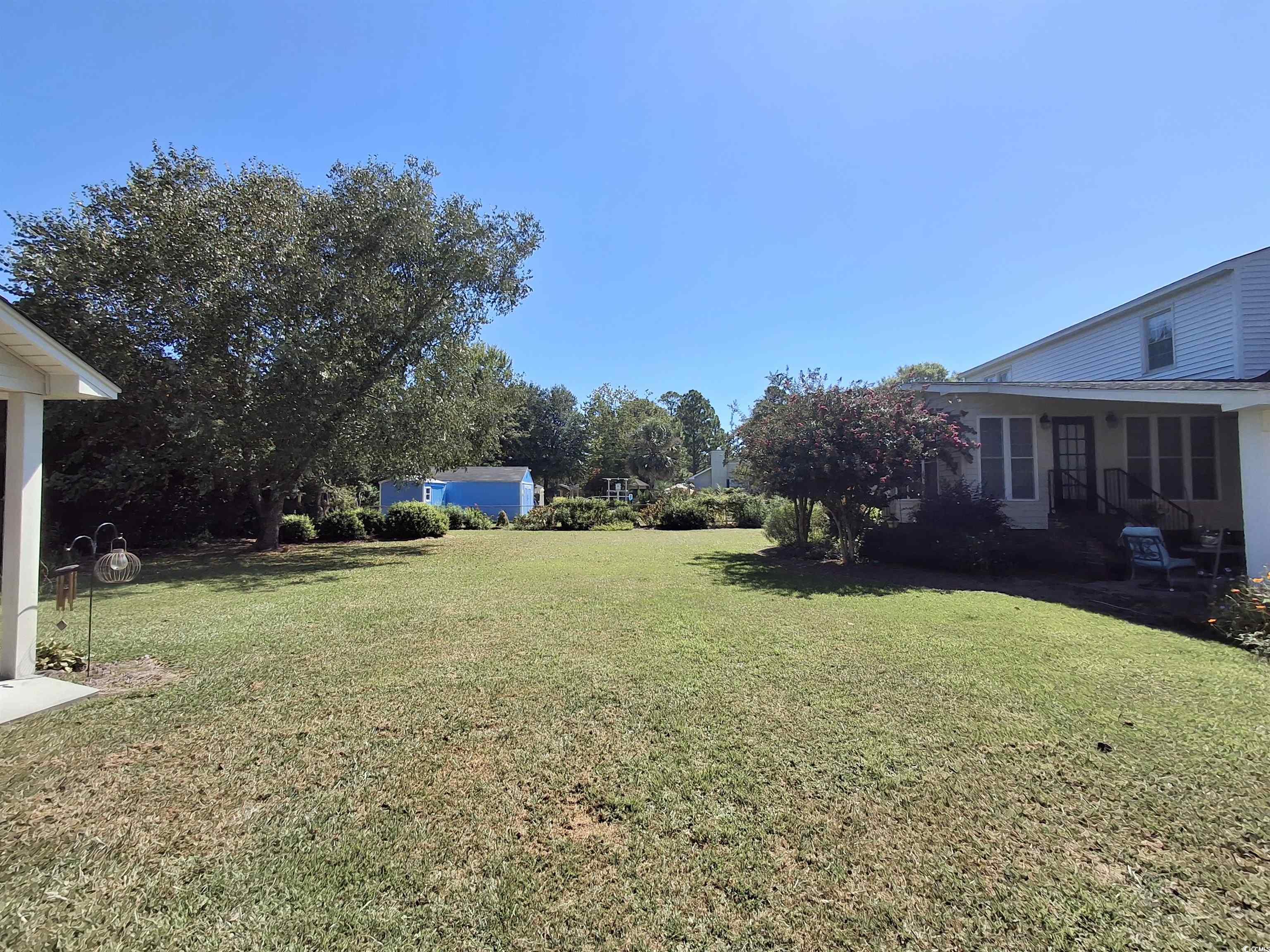 410 Devon Road Marion, SC 29571 - Photo 8 of 38 View of grassy yard with a patio area