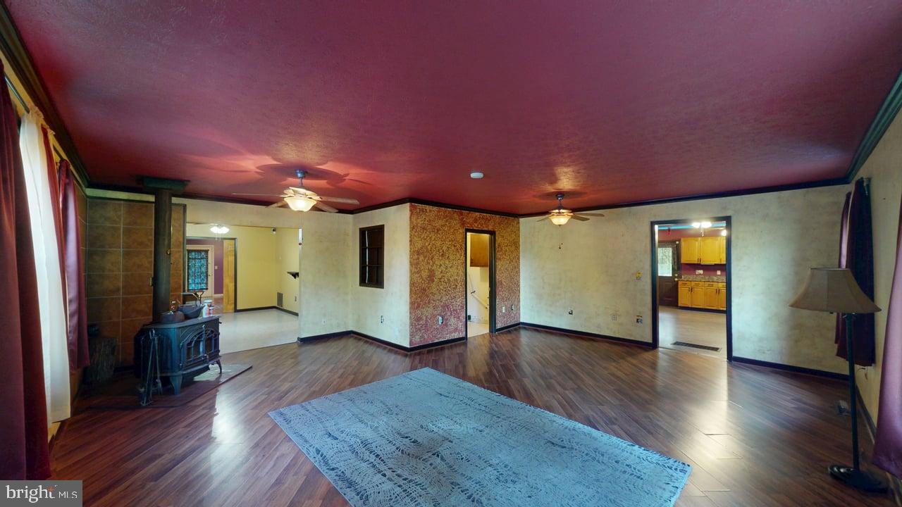 575 North River Highlands Road Delray, WV 26714 - Photo 31 of 48 Spacious room with rich red accents.