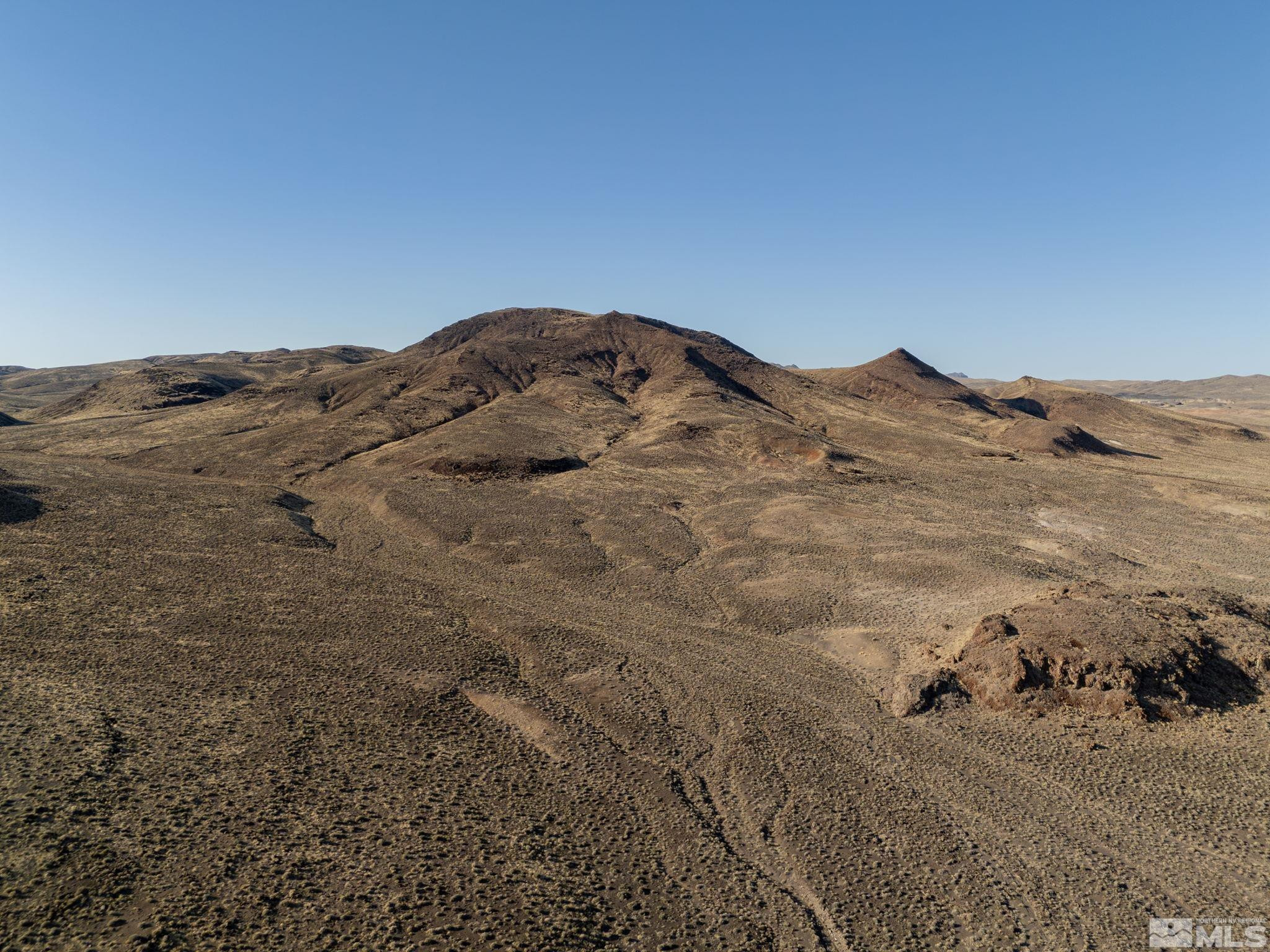 509113 Trinity Fallon, NV 89406 - Photo 18 of 24 a view of a mountain in the distance in a field
