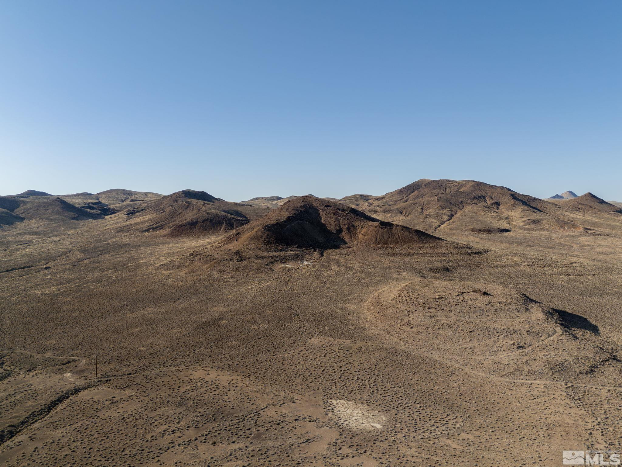 509113 Trinity Fallon, NV 89406 - Photo 9 of 24 a view of a large mountain in the distance in a field