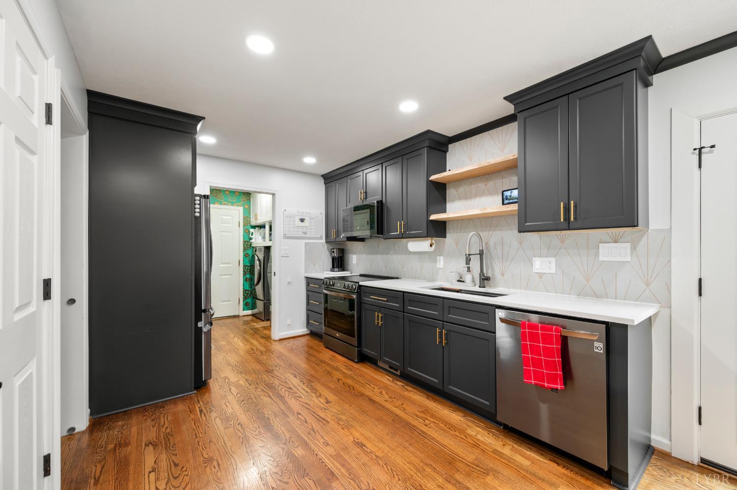 2002 Weatherhill Road Forest, VA 24551 - Photo 4 of 11 a kitchen with stainless steel appliances granite countertop a refrigerator and a sink
