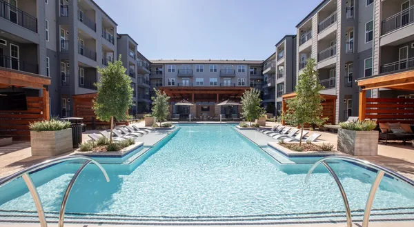 a view of a patio with chair and tables