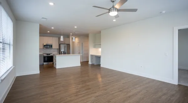a view of kitchen with wooden floor and window