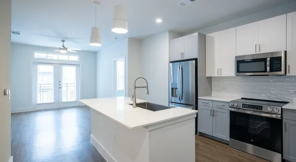 a kitchen with a stove and a microwave