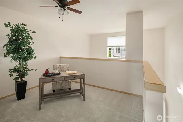a view of a room with a table and chair in it