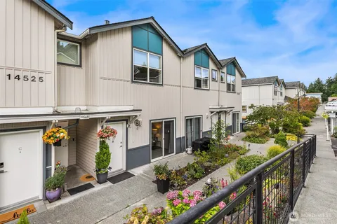 a view of a house with wooden fence