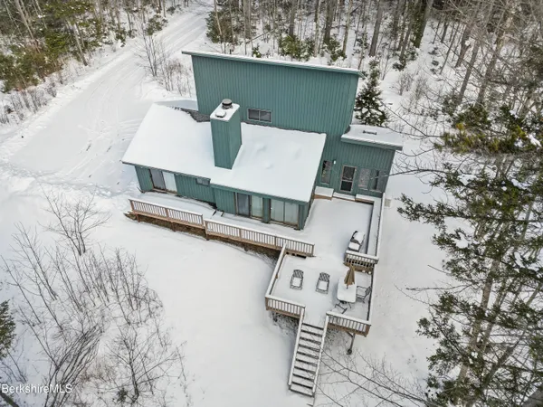 an aerial view of a house with roof deck