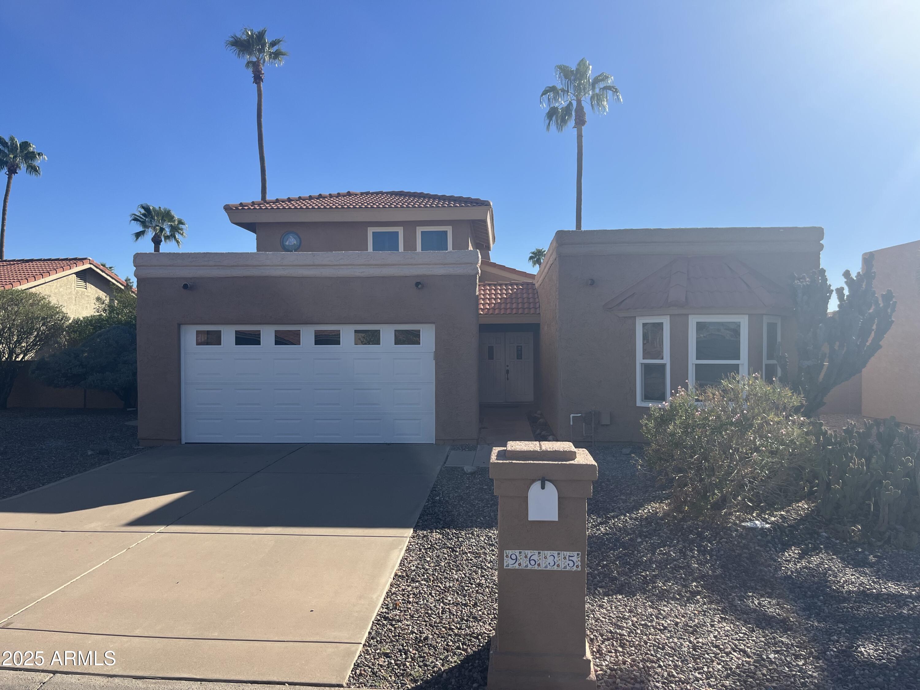 9635 East Palomino Place Sun Lakes, AZ 85248 - Photo 1 of 26 a front view of a house with a yard