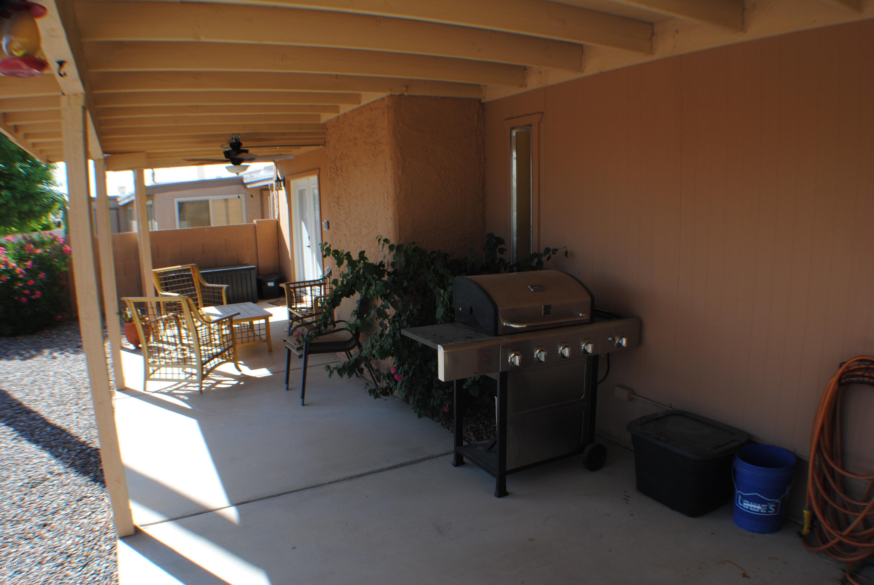 9635 East Palomino Place Sun Lakes, AZ 85248 - Photo 15 of 26 a room with furniture and a potted plant