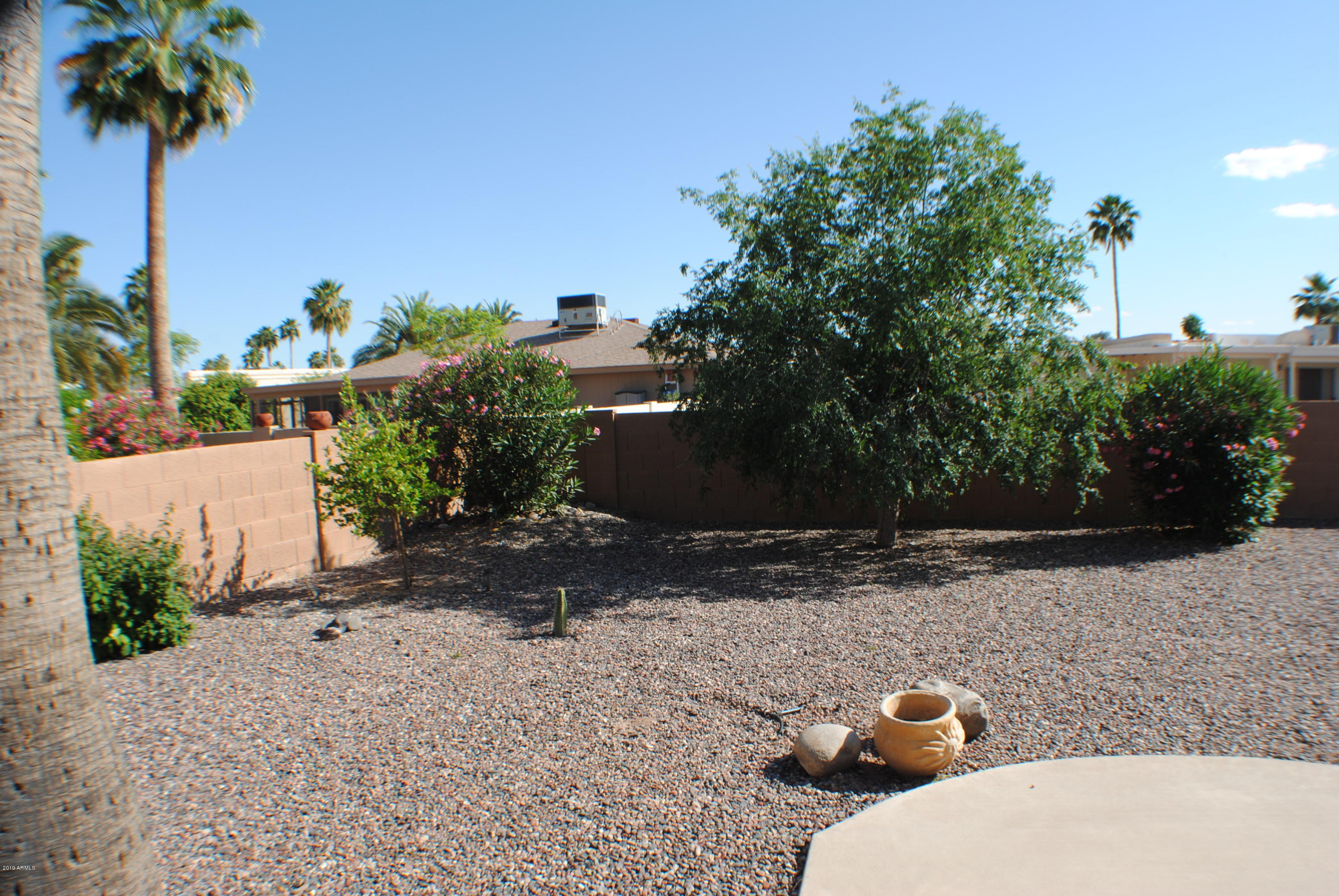 9635 East Palomino Place Sun Lakes, AZ 85248 - Photo 16 of 26 a view of a backyard of the house