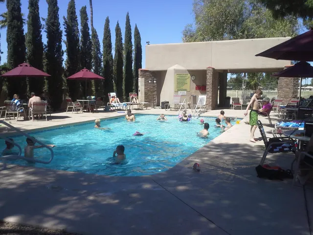 a view of swimming pool with outdoor seating