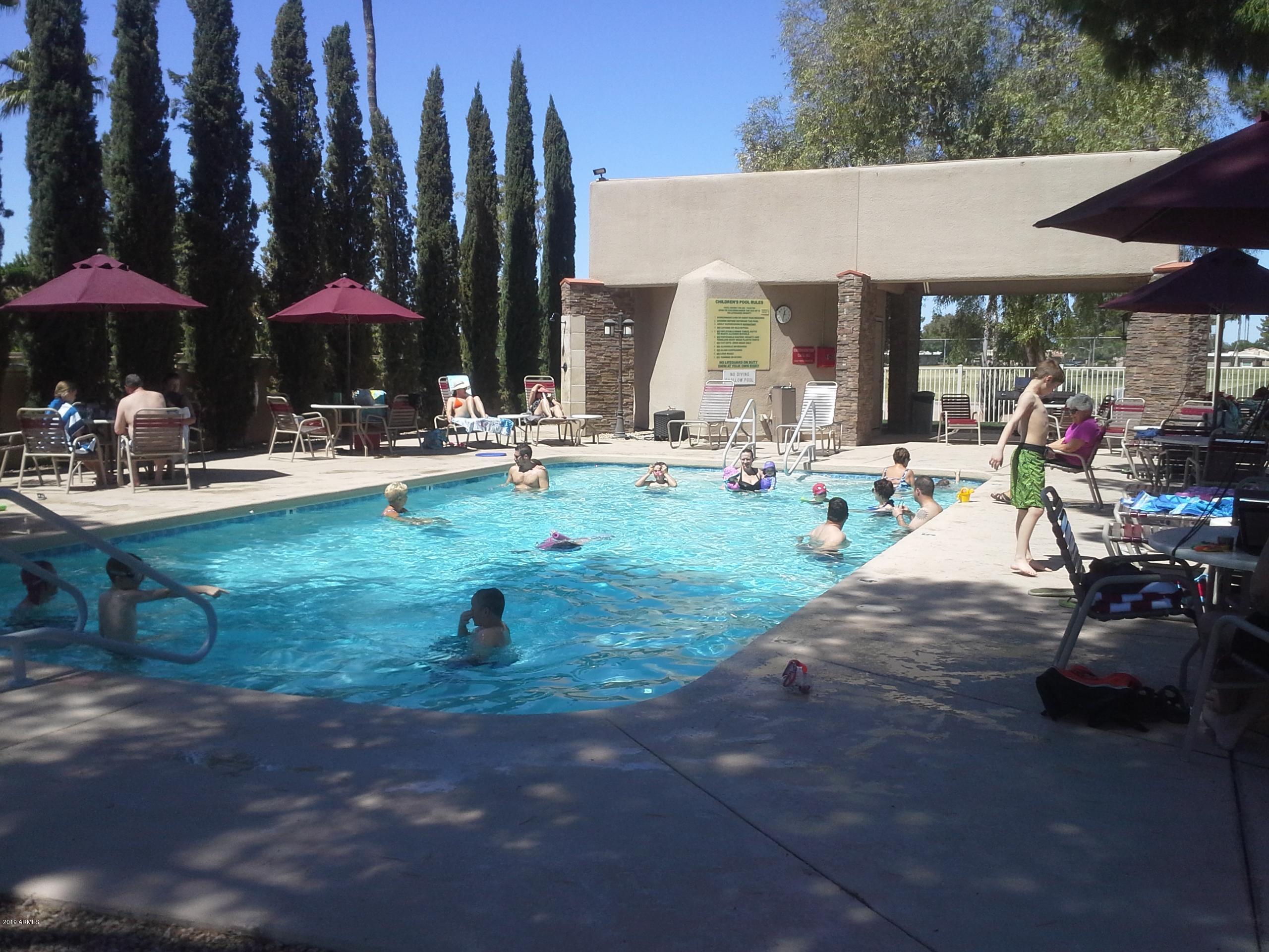 9635 East Palomino Place Sun Lakes, AZ 85248 - Photo 19 of 26 a view of swimming pool with outdoor seating
