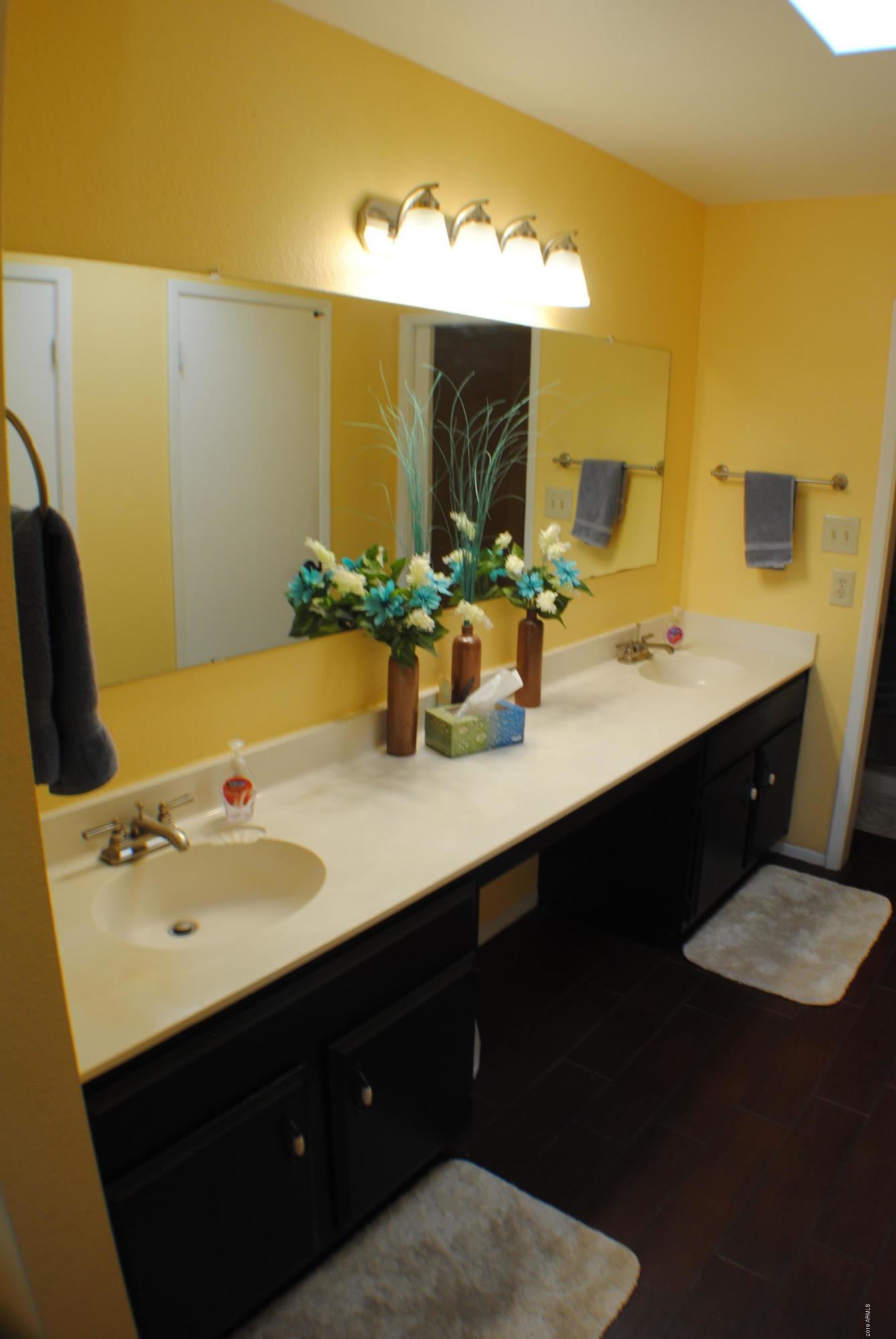 9635 East Palomino Place Sun Lakes, AZ 85248 - Photo 9 of 26 a bathroom with a sink and a mirror