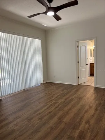 a bathroom with a tub sink double vanity and mirror