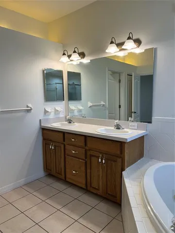 a bathroom with a toilet a sink and bathtub
