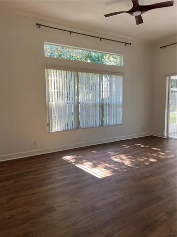 a bathroom with a sink a toilet and a window