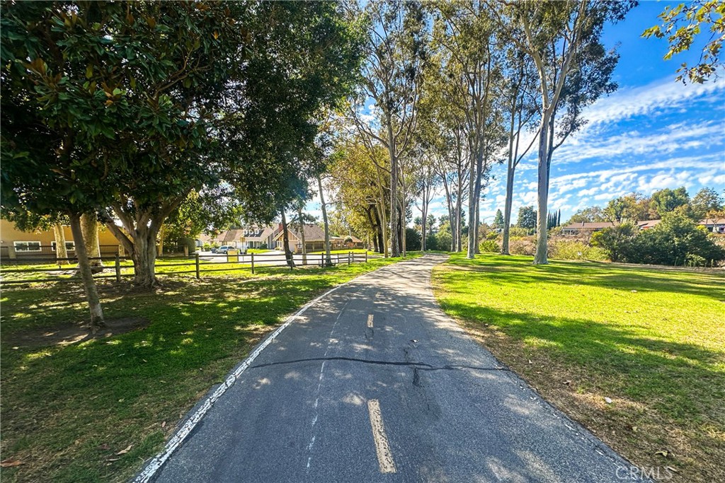 21902-21902 Raintree Lane Lake Forest, CA 92630 - Photo 35 of 46 a view of a swimming pool with an outdoor space and seating area