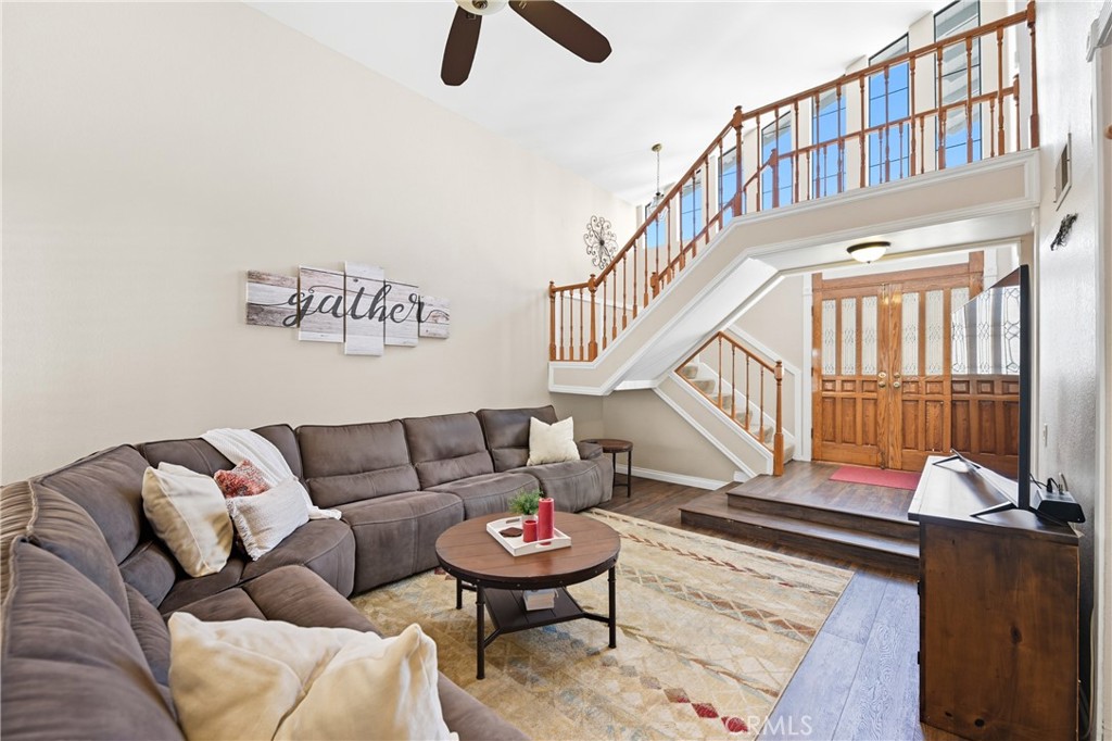 21902-21902 Raintree Lane Lake Forest, CA 92630 - Photo 5 of 46 a living room with furniture and a book shelf