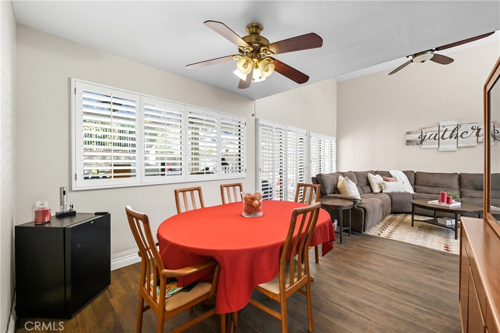 21902-21902 Raintree Lane Lake Forest, CA 92630 - Photo 7 of 46 a view of a dining room with furniture and wooden floor