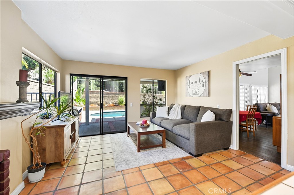 21902-21902 Raintree Lane Lake Forest, CA 92630 - Photo 9 of 46 a living room with furniture and a floor to ceiling window
