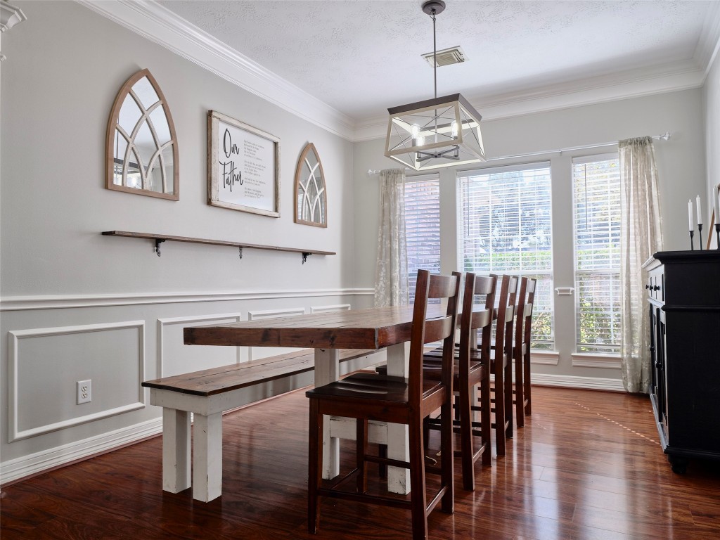 9315 Anna Street Needville, TX 77461 - Photo 11 of 46 a view of a dining room with furniture window and wooden floor