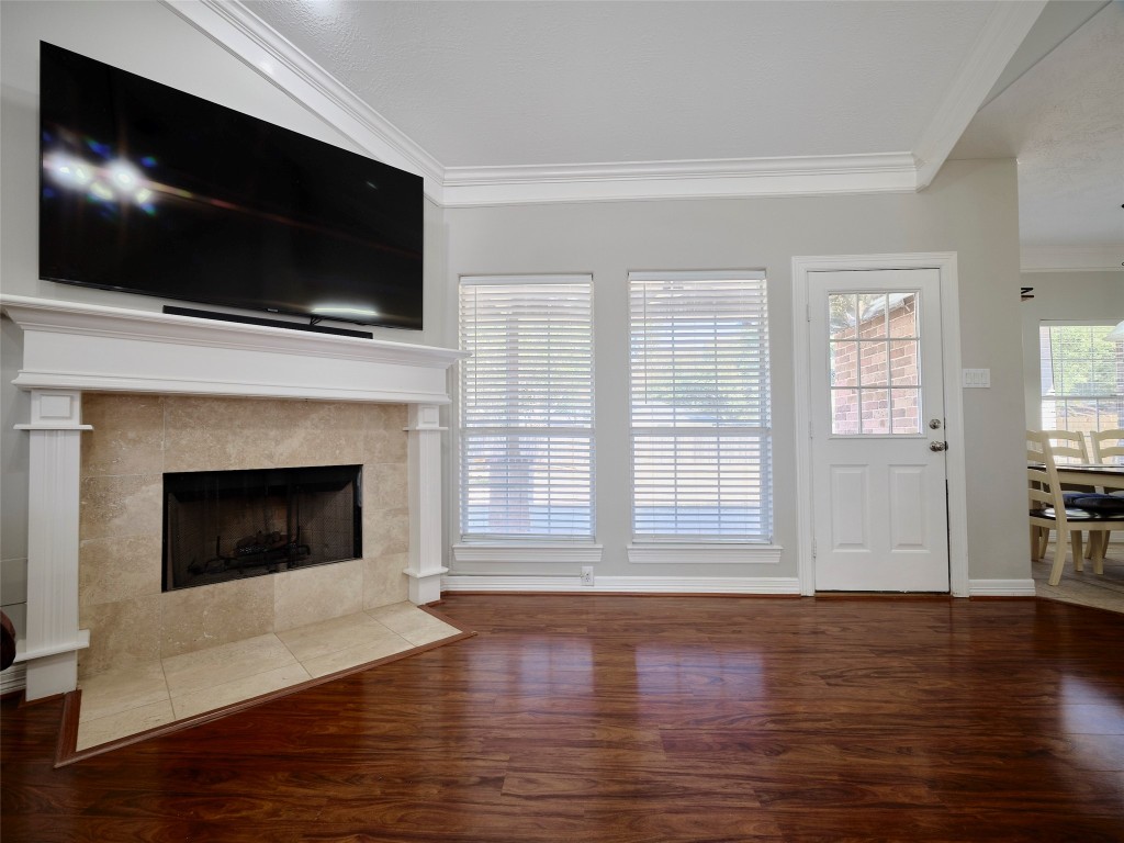 9315 Anna Street Needville, TX 77461 - Photo 14 of 46 a living room with a flat screen tv and a fireplace