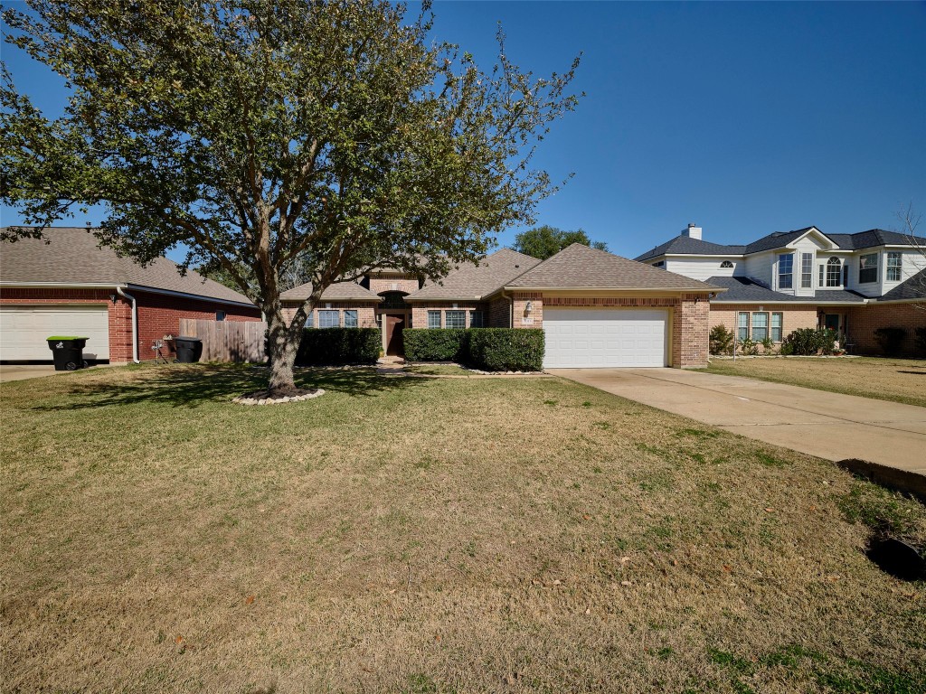 9315 Anna Street Needville, TX 77461 - Photo 2 of 46 a front view of a house with a yard