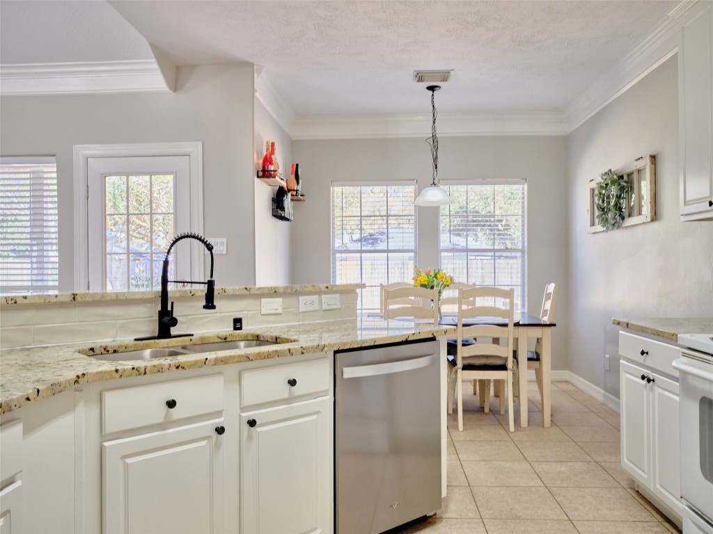 9315 Anna Street Needville, TX 77461 - Photo 23 of 46 a kitchen with a sink and stove
