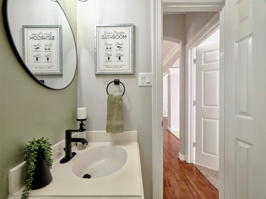 9315 Anna Street Needville, TX 77461 - Photo 36 of 46 a bathroom with a sink and a mirror