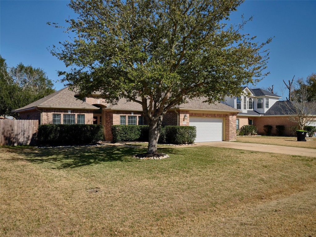 9315 Anna Street Needville, TX 77461 - Photo 4 of 46 a front view of a house with a yard