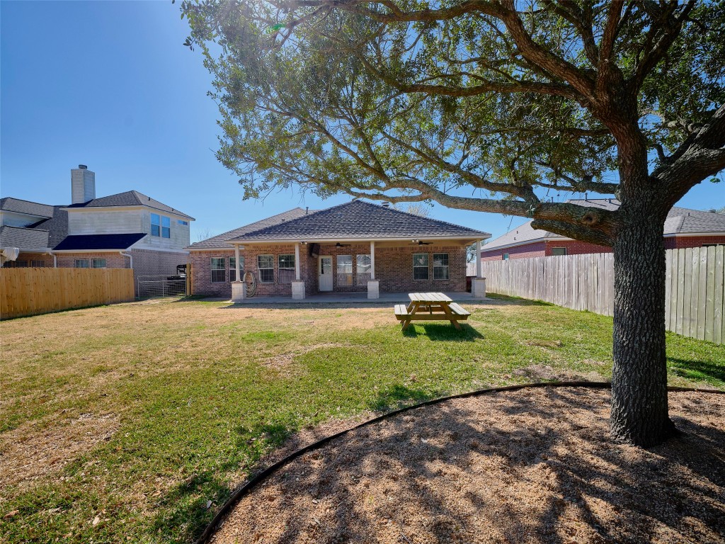 9315 Anna Street Needville, TX 77461 - Photo 46 of 46 a front view of a house with a yard