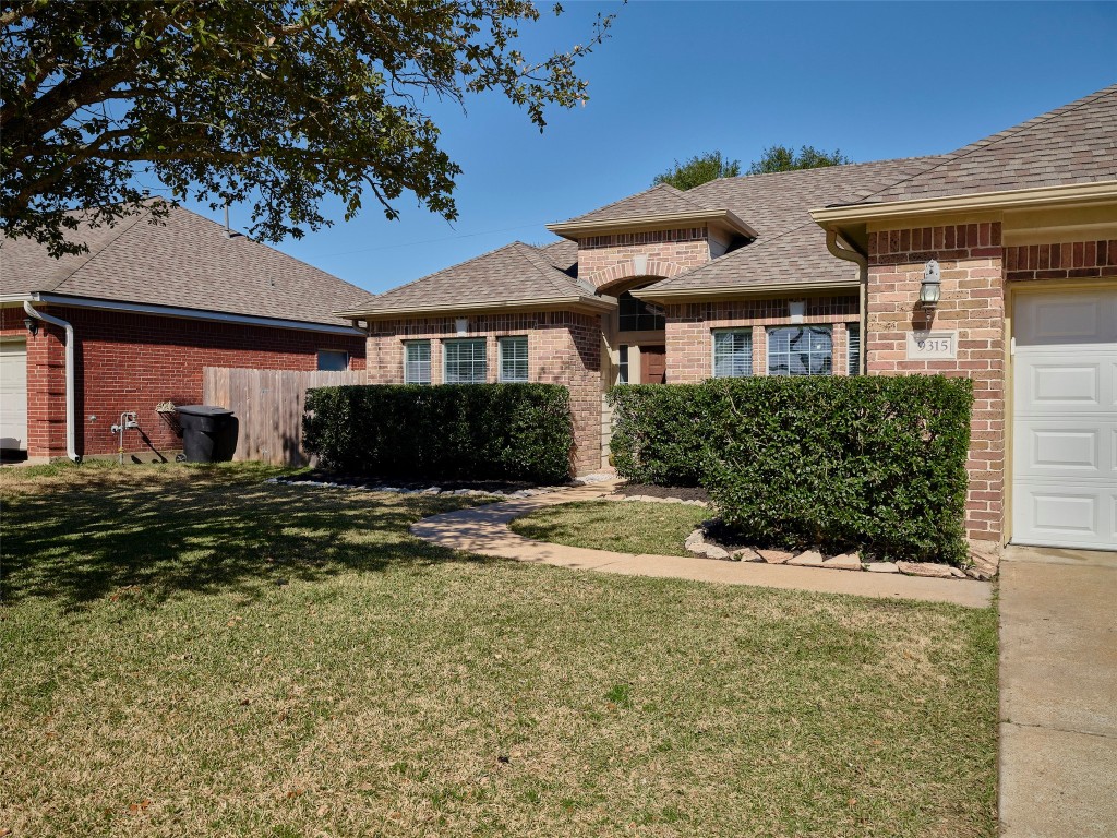 9315 Anna Street Needville, TX 77461 - Photo 5 of 46 front view of a house with a yard