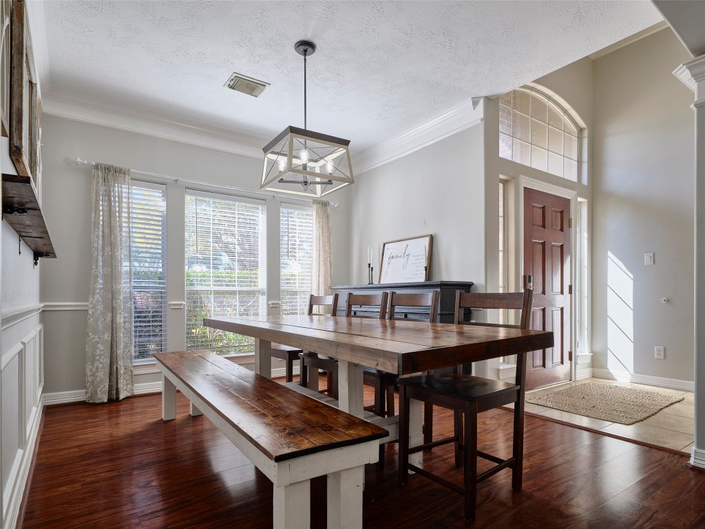 9315 Anna Street Needville, TX 77461 - Photo 9 of 46 a view of a dining room with furniture window and wooden floor